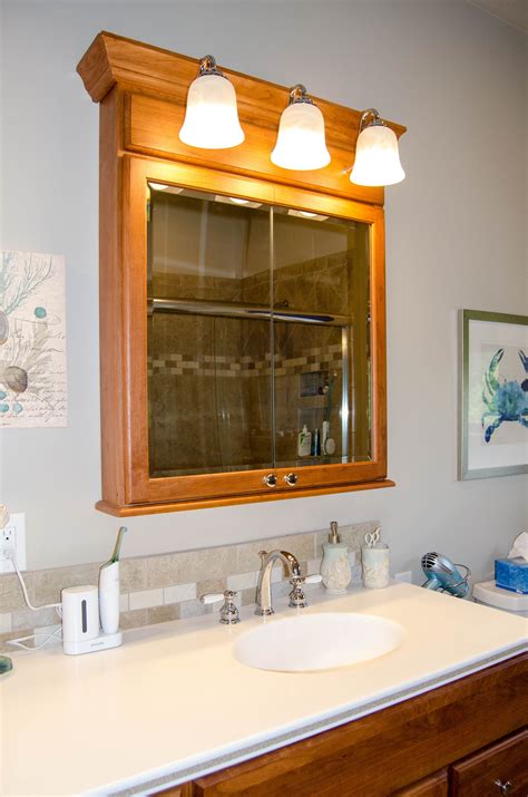 medicine cabinet with overhead lights